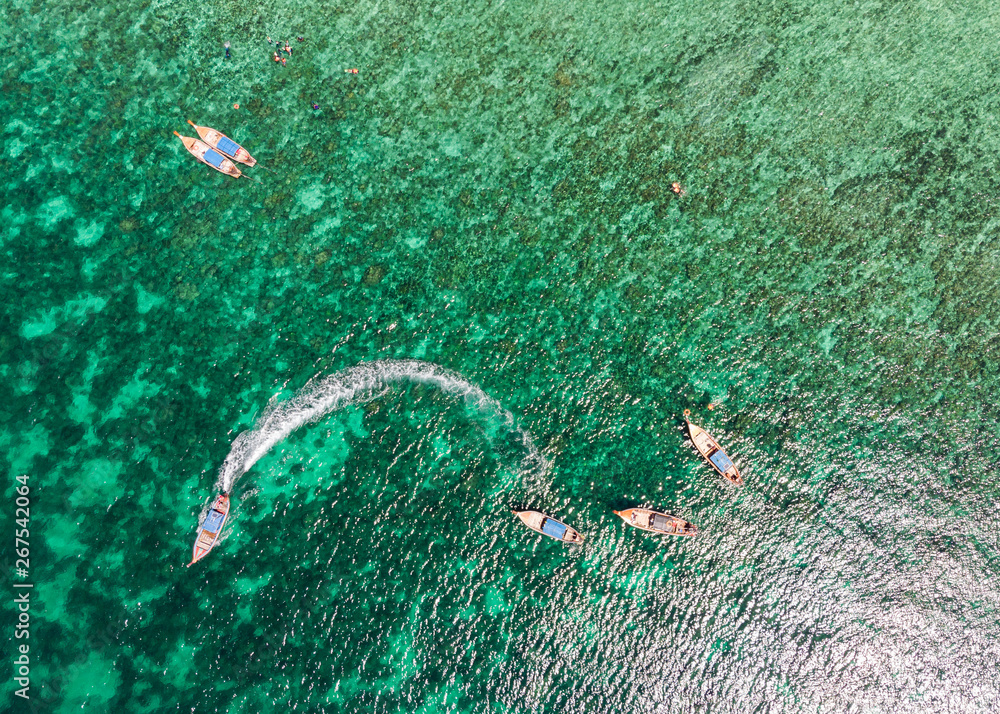 Beautiful tropical sea with wooden long-tail boat sailing at lipe island