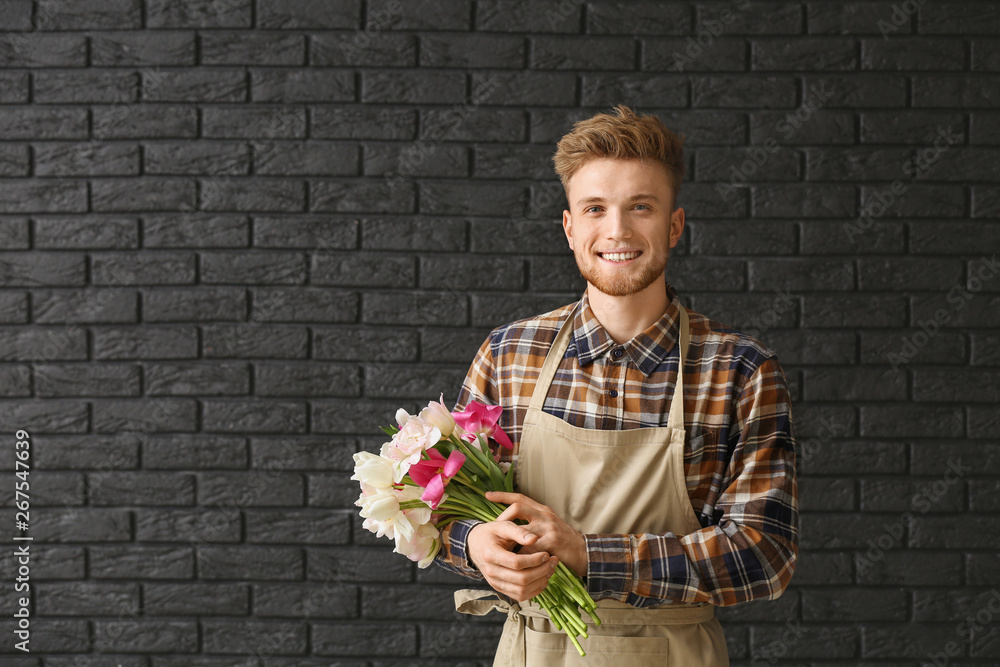 Handsome florist on dark background