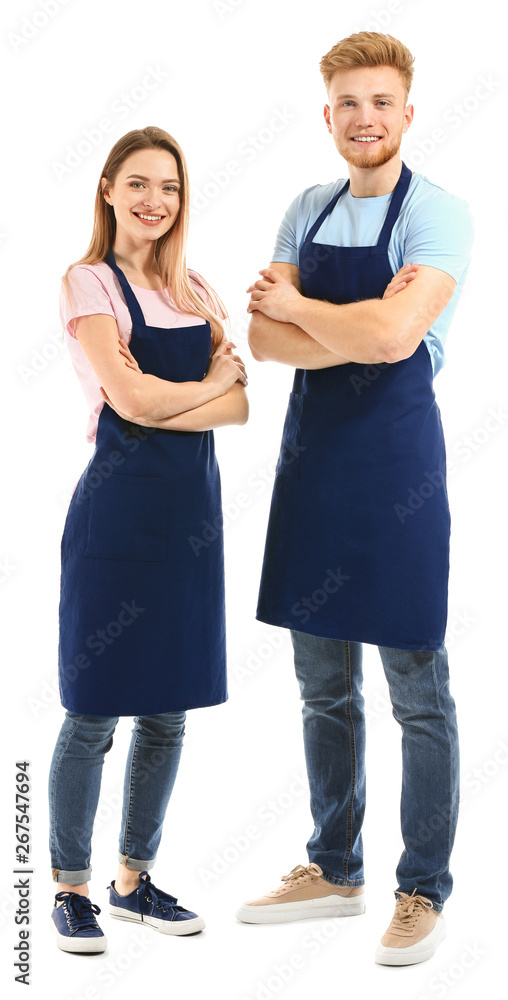 Man and woman in aprons on white background