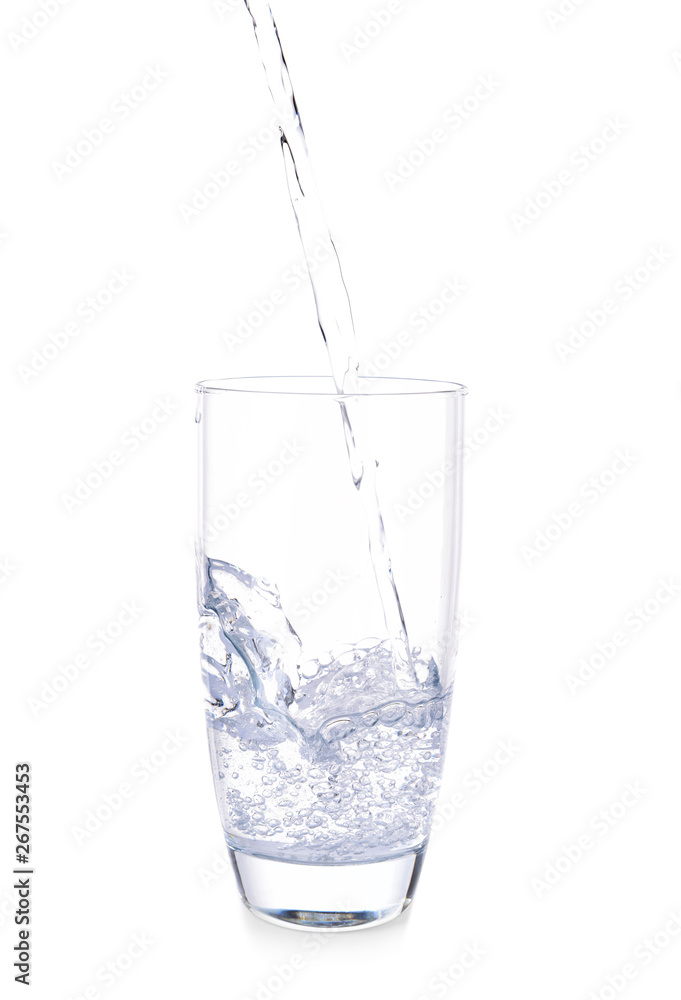 Pouring of fresh water into glass on white background