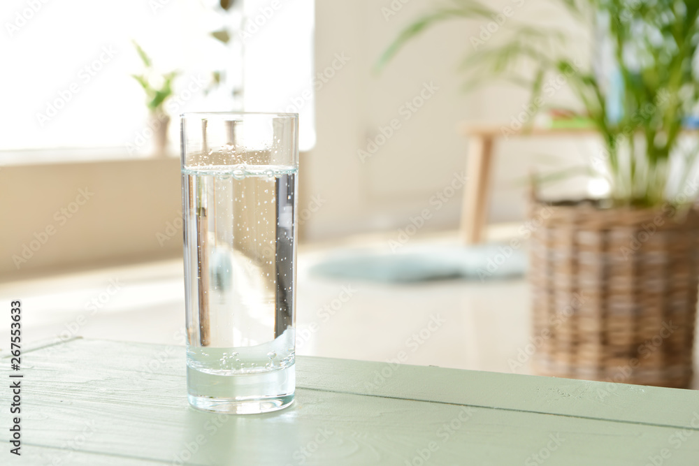 Glass of fresh water on table