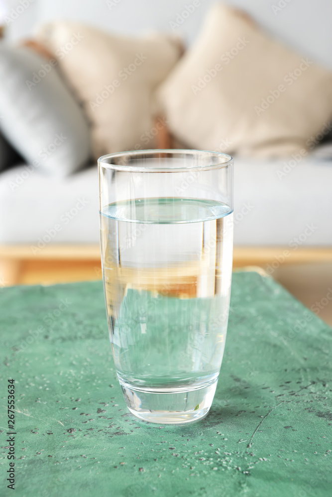 Glass of fresh water on table