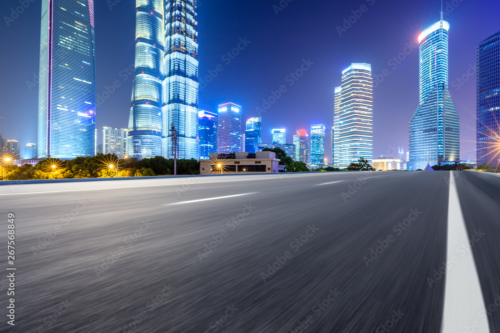 Motion blurred highway and skyline of modern urban buildings in Shanghai