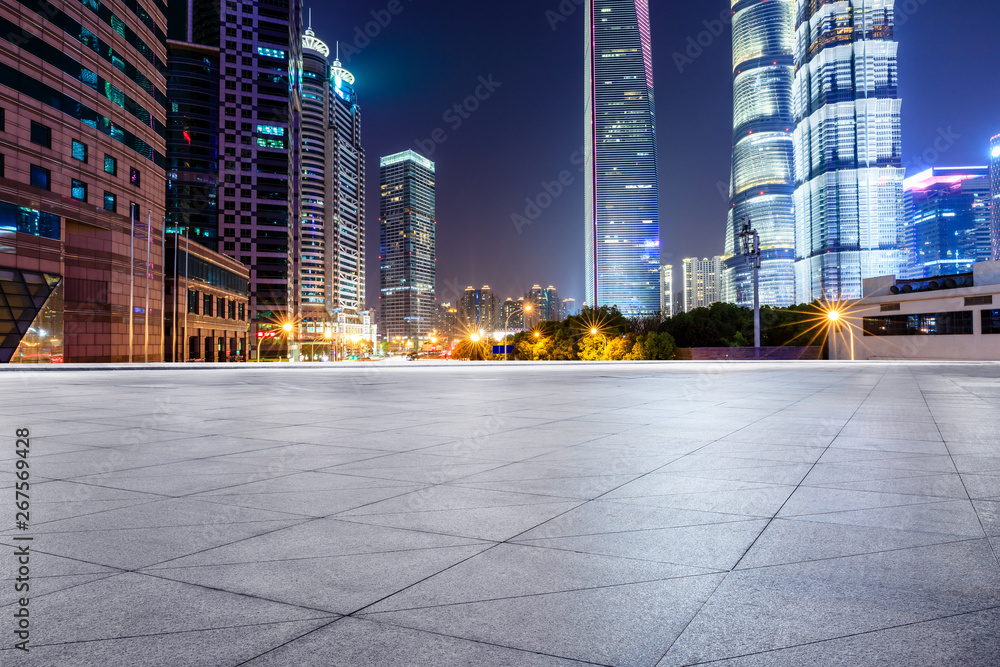 Shanghai modern commercial office buildings and square floor at night