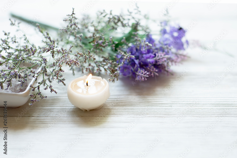 Spa setting relax composition  burning candles and lavender flowers on white wooden background ,well