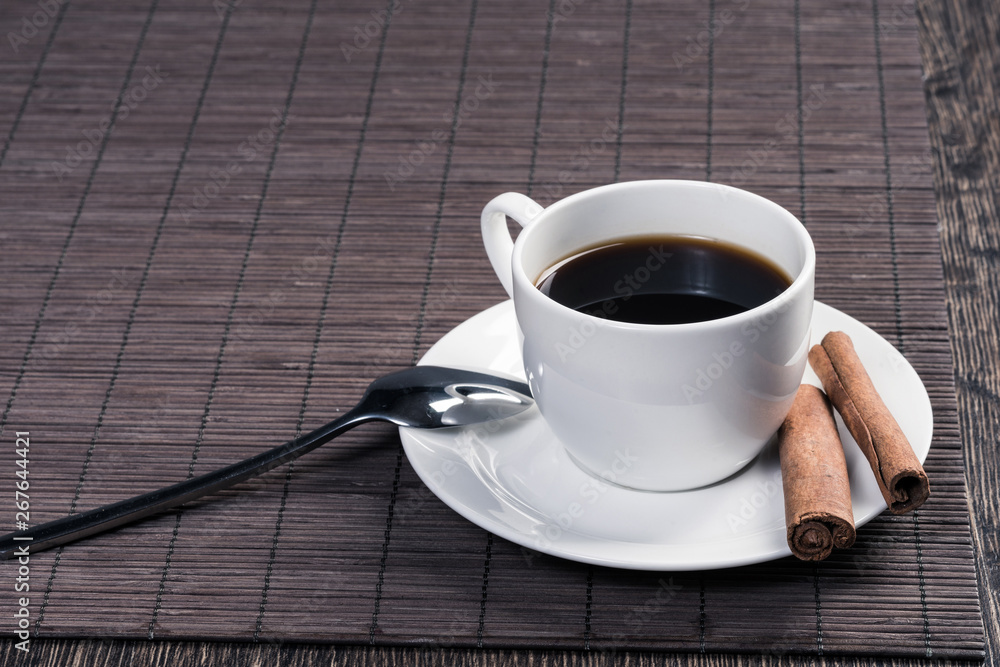 Cup of black coffee on wooden table