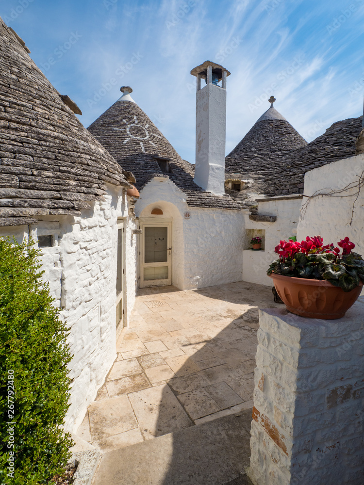 ALBEROBELLO, ITALY - April, 2019: Alberobellos famous Trulli, the characteristic cone-roofed houses