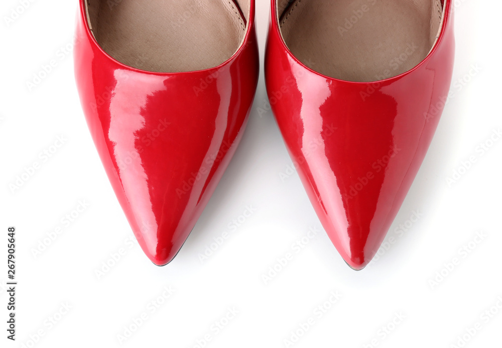 Pair of stylish female shoes on white background