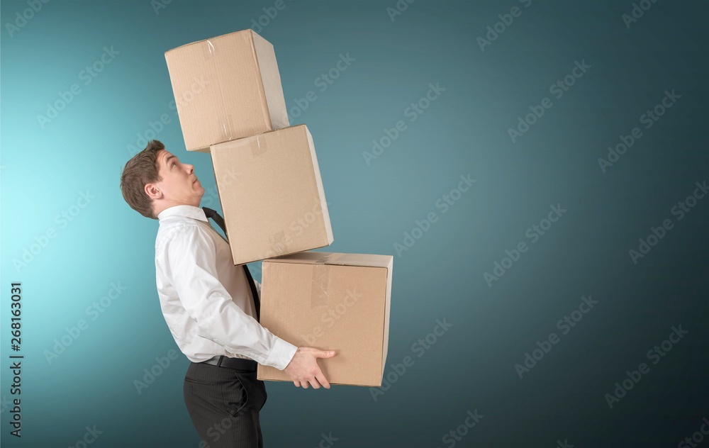 Man with cardboard boxes on background