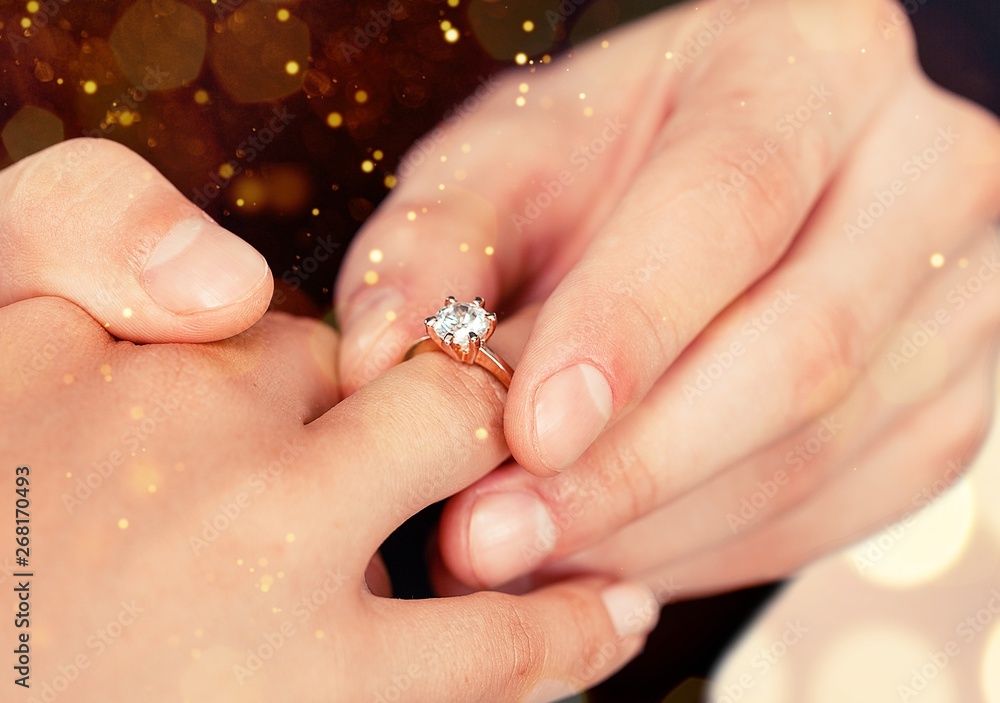 Close up Groom Putting the Wedding Ring on bride