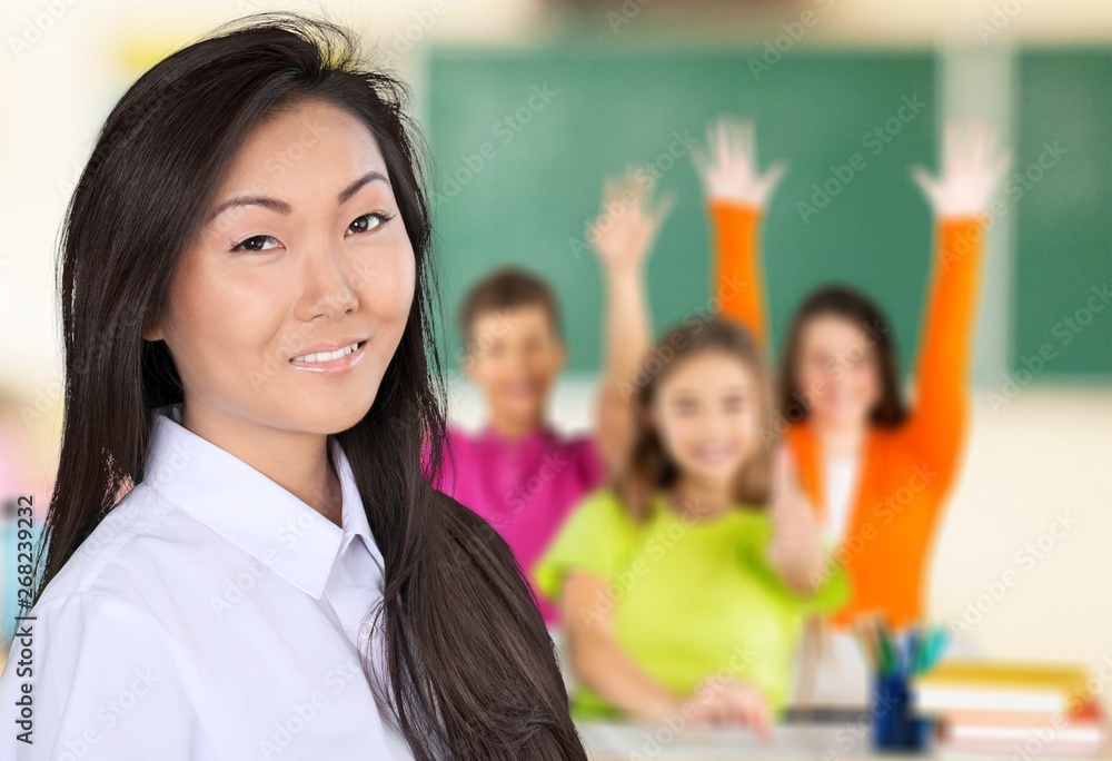 Female teacher with children at class on