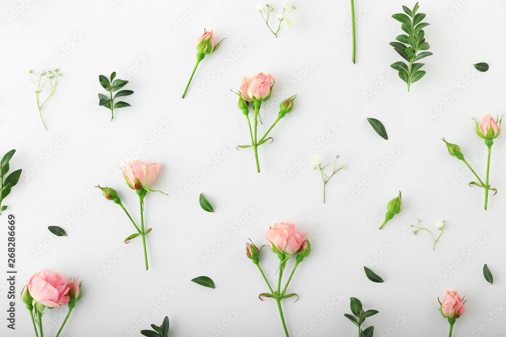 Beautiful flowers with leaves on white background