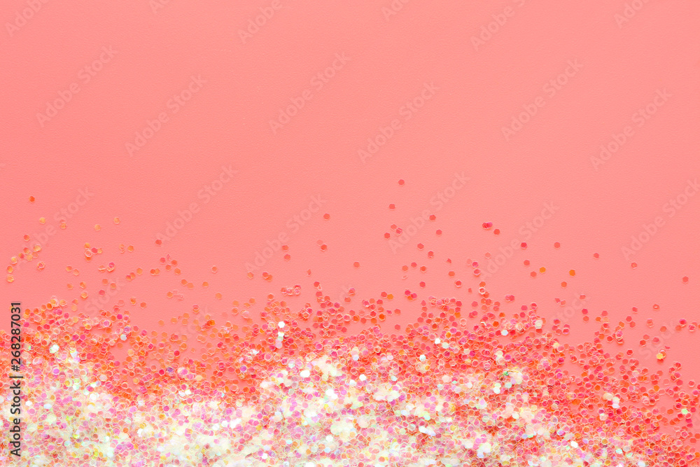 Shiny iridescent glitters on color background