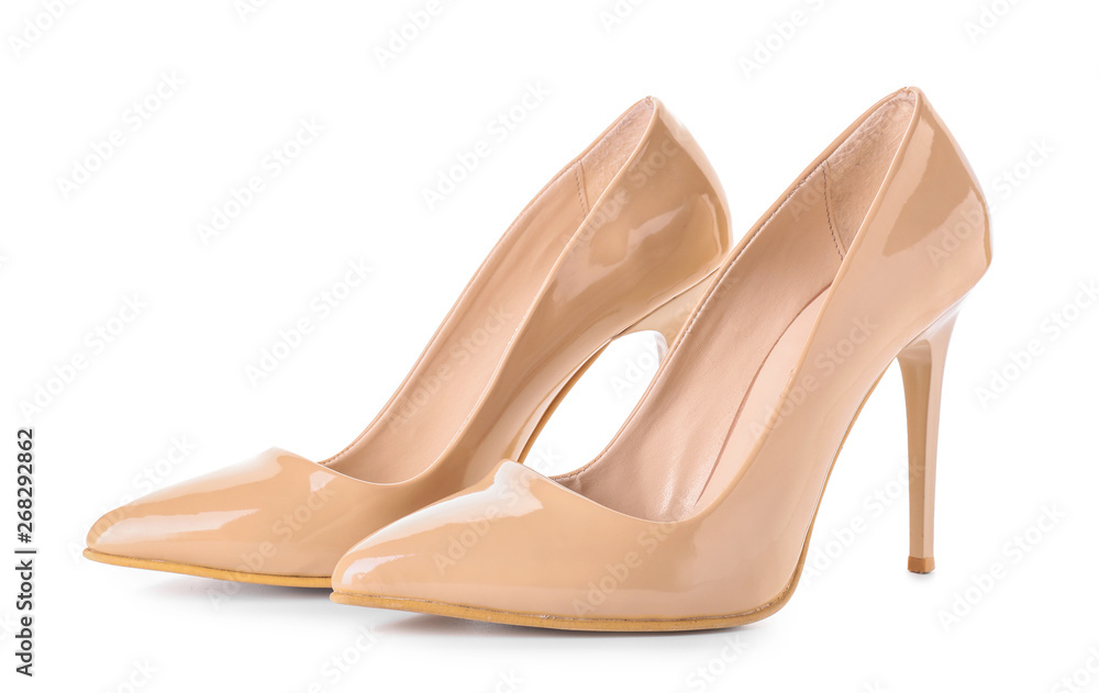 Pair of stylish female shoes on white background