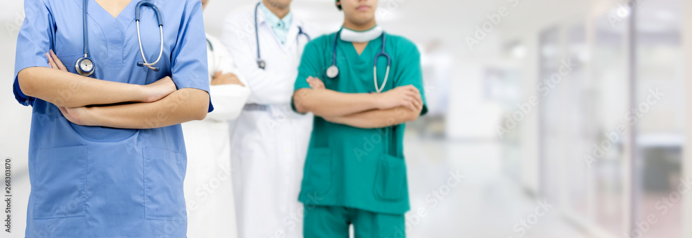 Medical team staff - General practitioner doctor, surgical doctor and nurse standing in hospital off