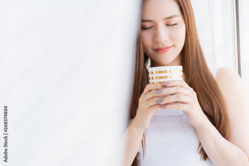 beautiful attractive asian girl white tshirt enjoy weekend vacation with hot drink in white interior