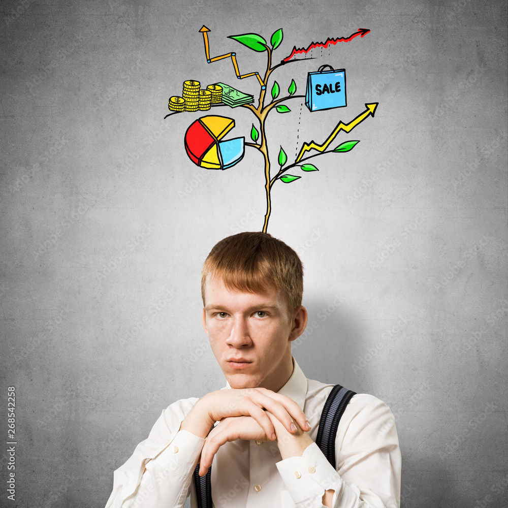 Serious student with arms touching his chin