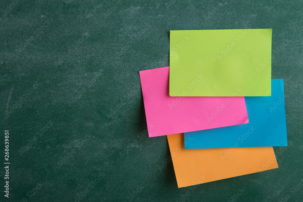 Colorful sticky notes on the blank blackboard