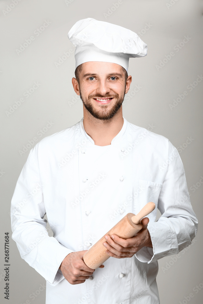 Male chef on light background