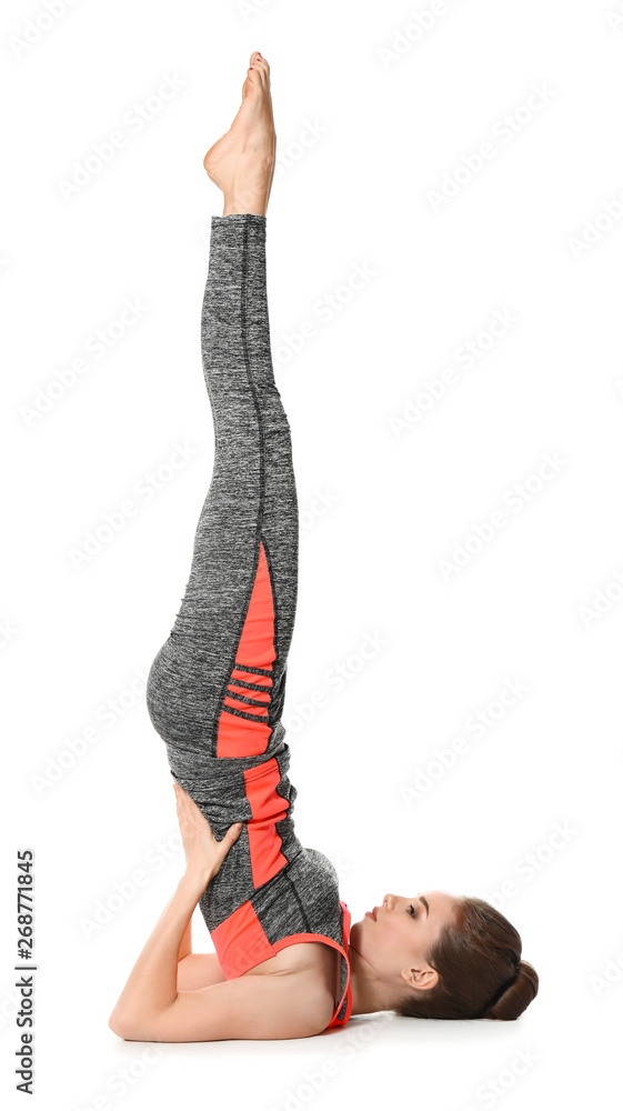 Sporty woman practicing yoga on white background