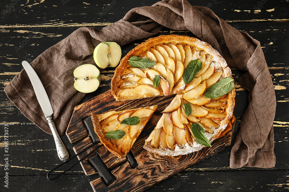 Tasty apple pie on wooden table