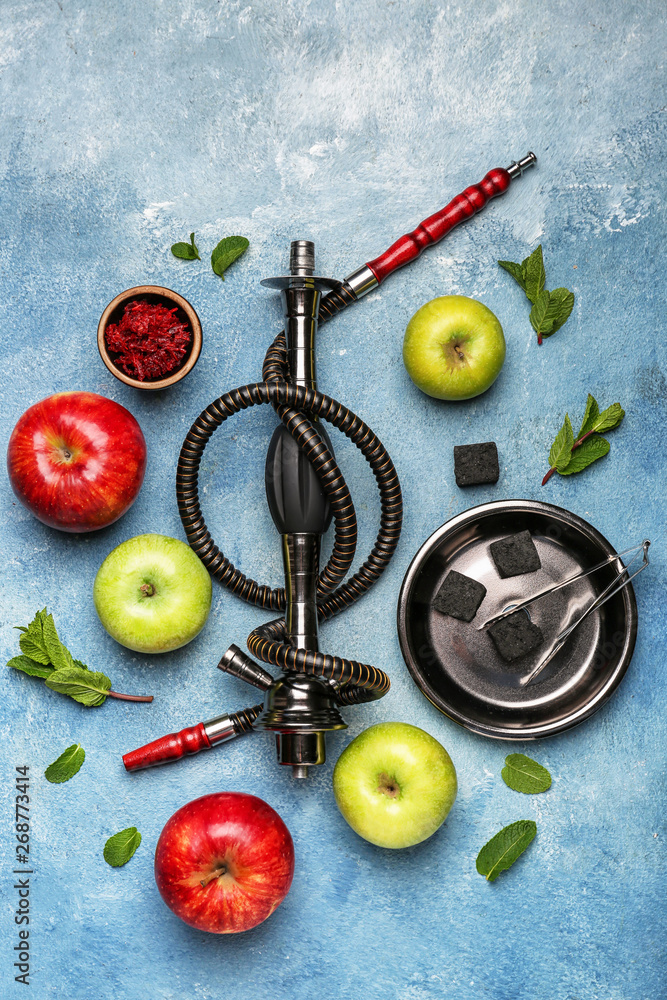 Composition with parts of hookah and fruits on color background