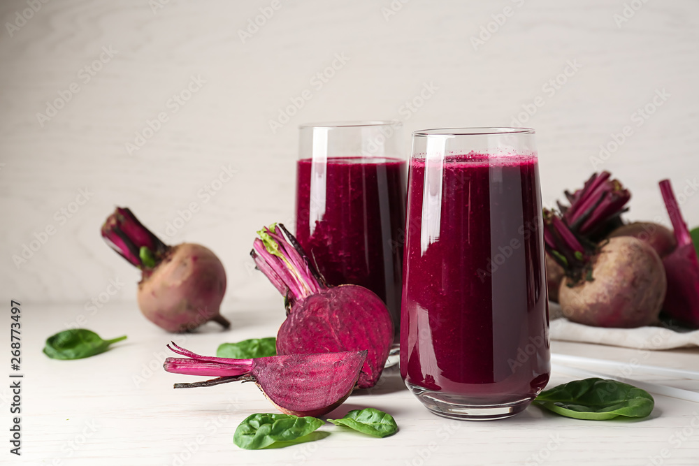 Glasses of fresh beet smoothie on table