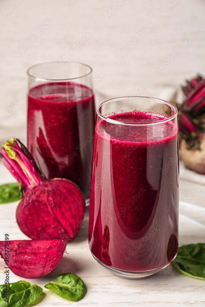 Glasses of fresh beet smoothie on table