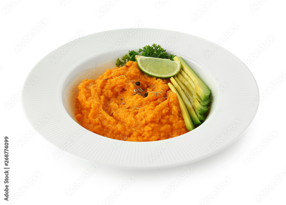 Plate with mashed sweet potato and avocado on white background