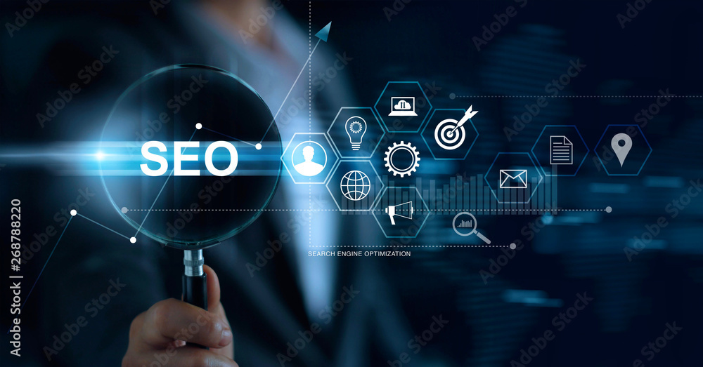 SEO Search Engine Optimization Marketing concept. Businessman with magnifying glass in hand searchin