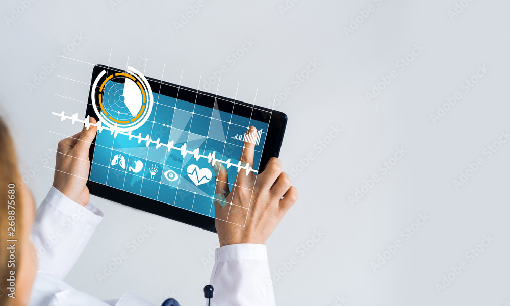 Close of female doctor hands working with tablet pc computer