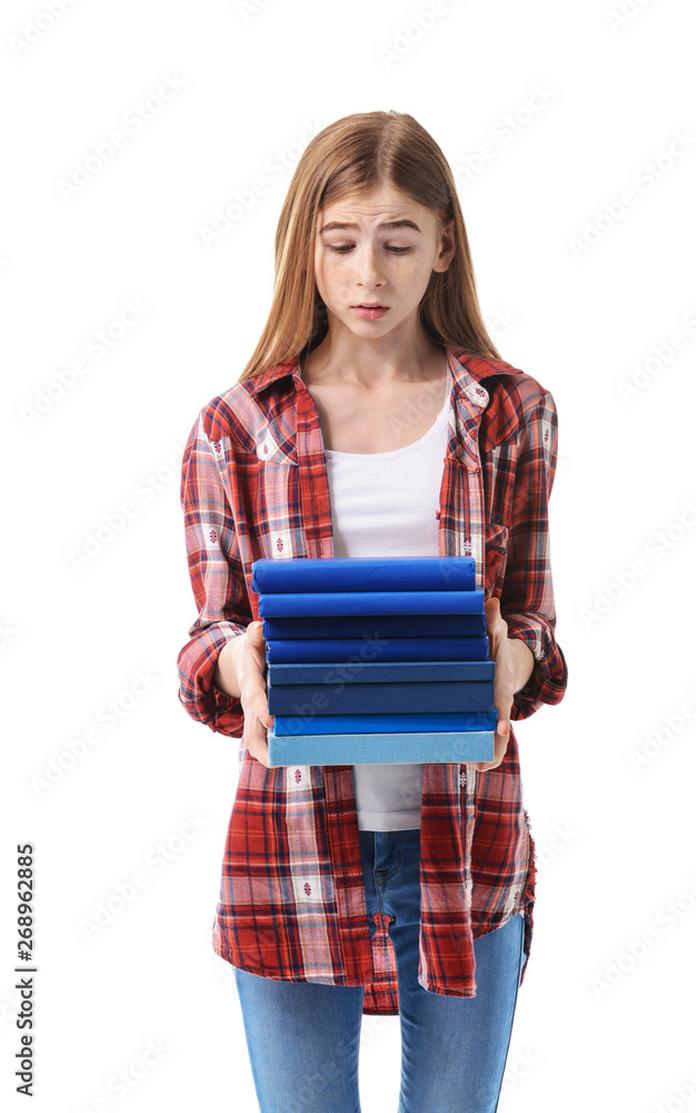 Stressed teenage girl with a lot of books on white background