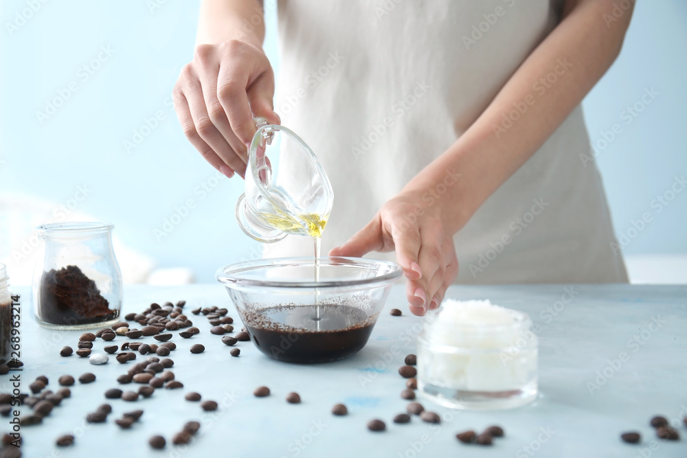 Woman preparing body scrub at table