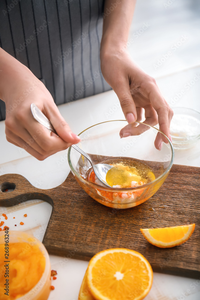 Woman preparing body scrub at table