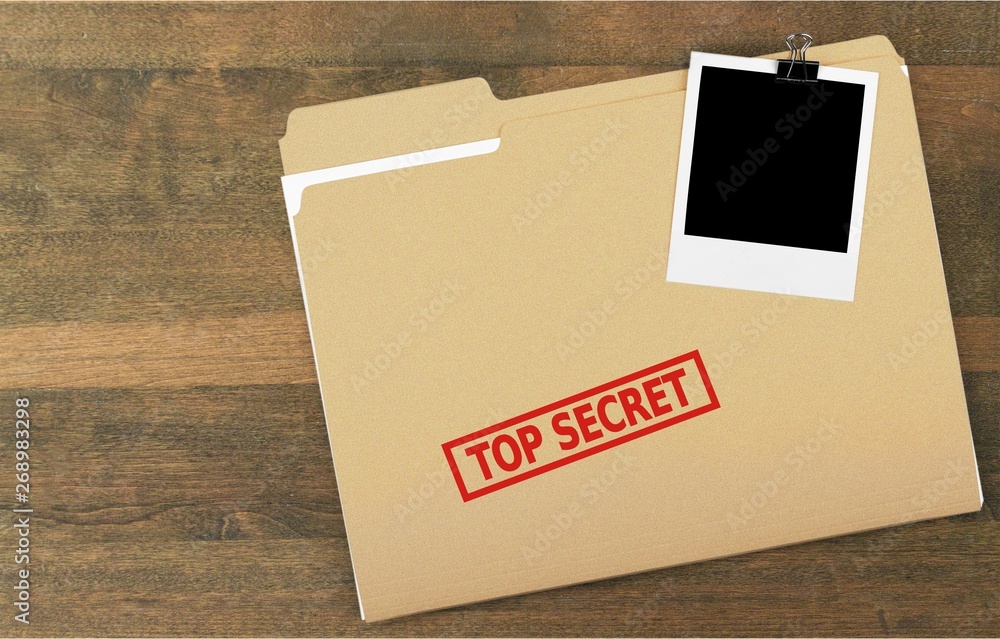 Folder  with the words Top Secret stamped on it, Isolated on a white background.