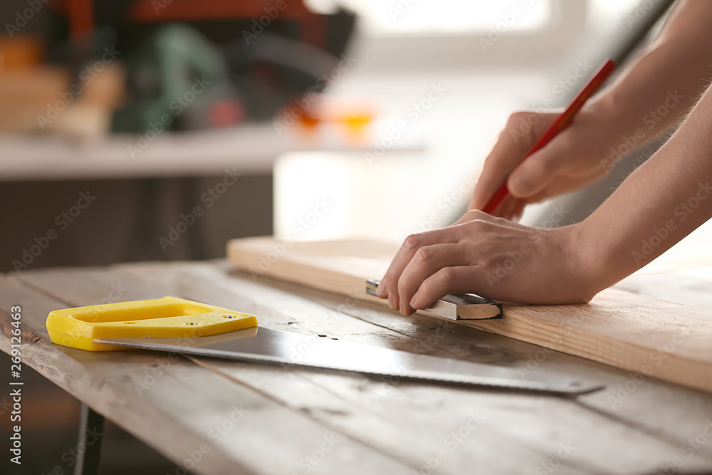 Male carpenter working in shop