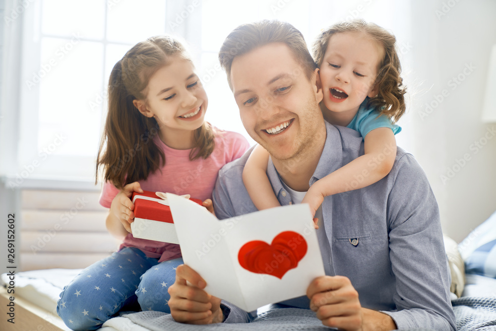 daughters congratulating dad