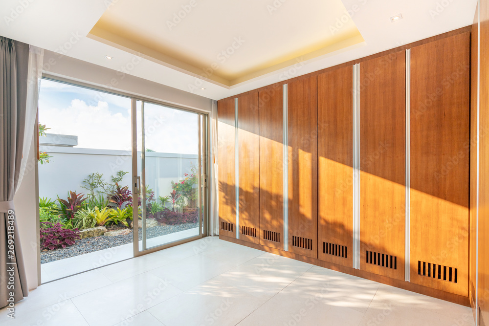 wooden built in wardrobe with green garden