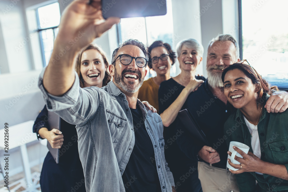 Business people taking a selfie