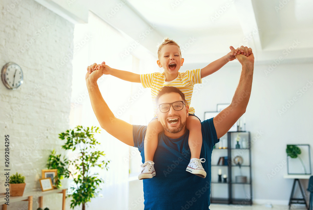 Fathers day. Happy family son hugs his dad