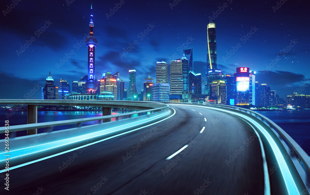 Highway overpass modern Shanghai city skyline background . Night scene .