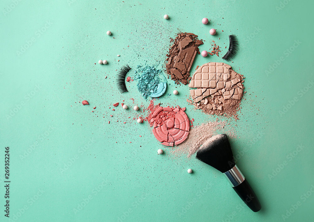 Different cosmetic products on color background