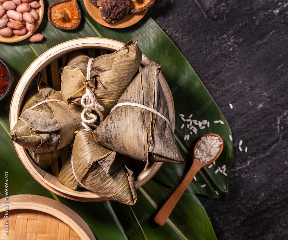 Zongzi, delicious fresh hot steamed rice dumplings in steamer. Close up, copy space, famous asian ta