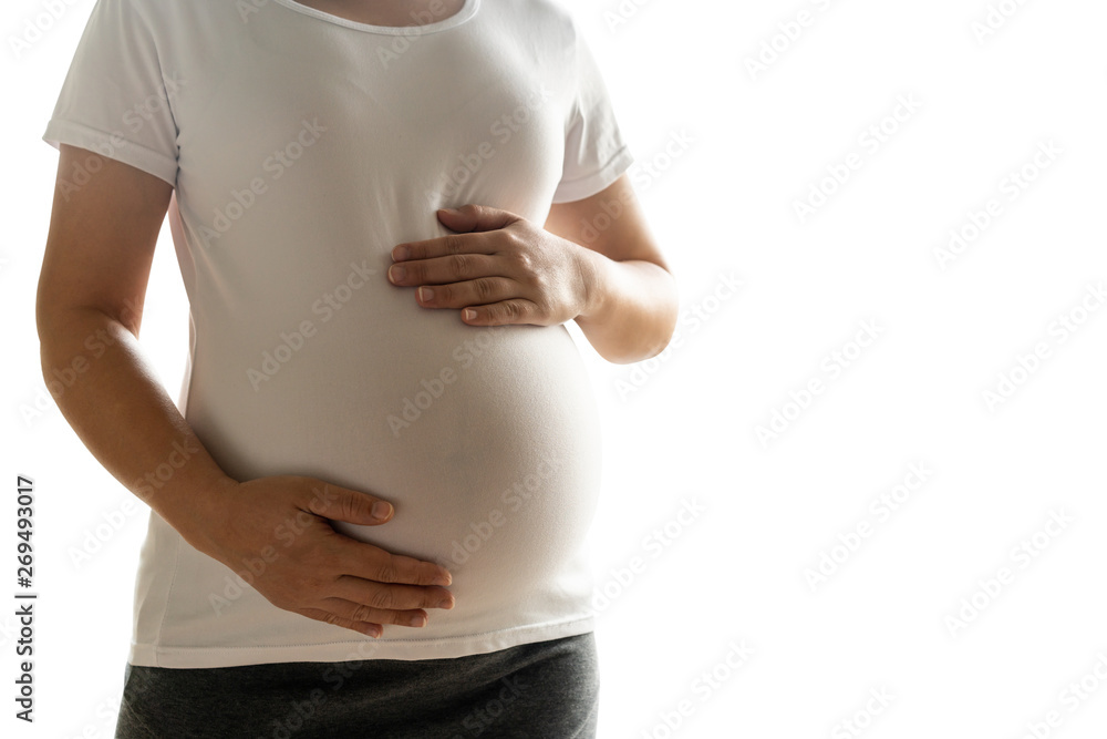 Happy pregnant woman taking care of her child isolated on white background. The young expecting moth