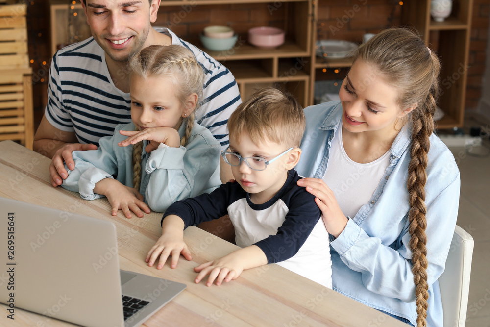 Happy family watching cartoons at home