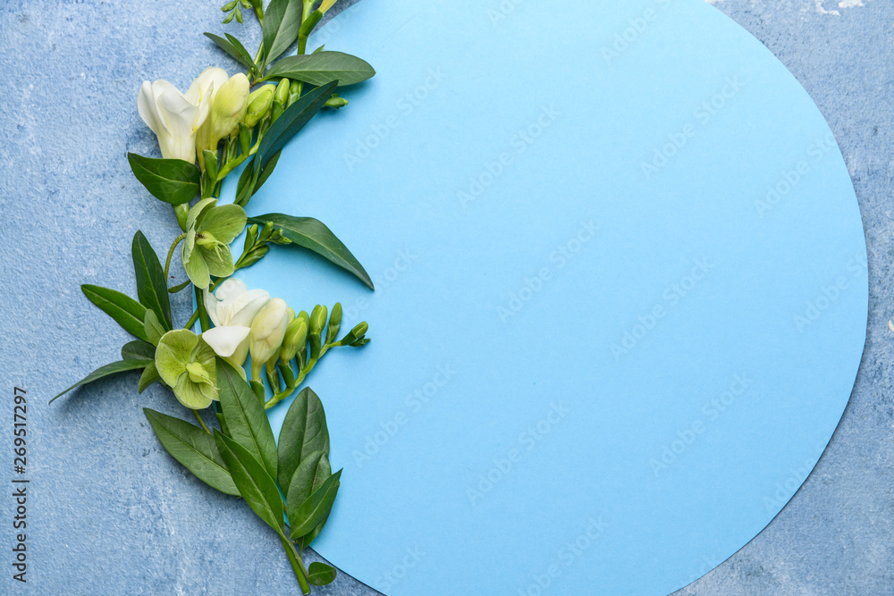 Beautiful flowers and blank card on color background