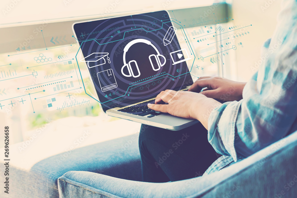 E-learning concept with woman using her laptop in her home office