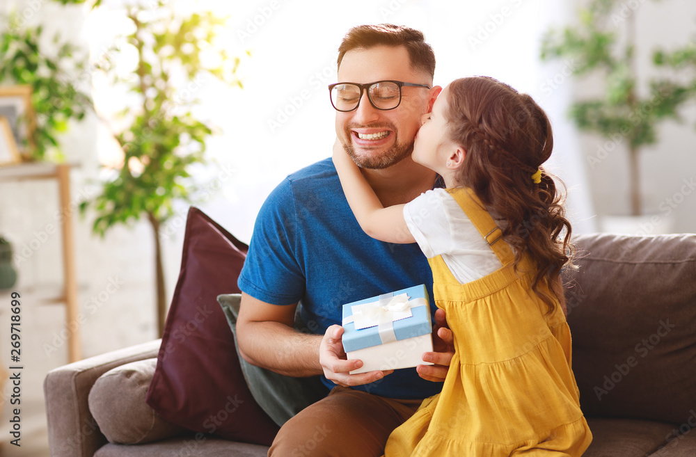 Fathers day. Happy family daughter hugging dad and laughs