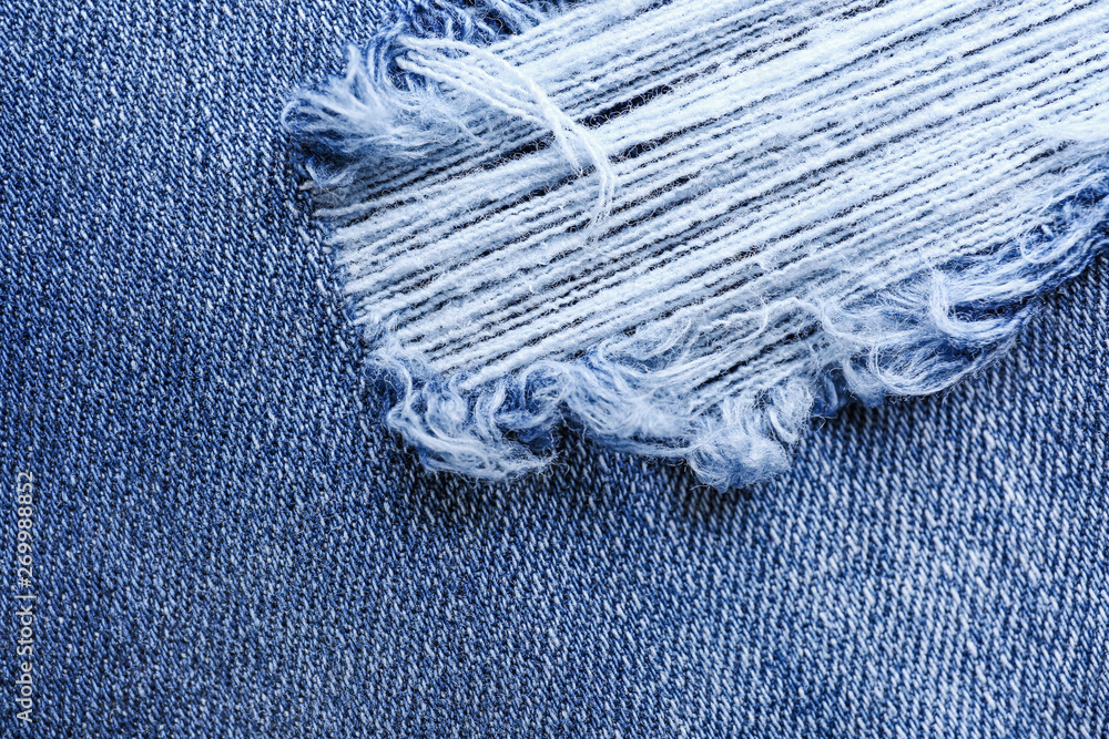 Stylish ripped jeans, closeup view