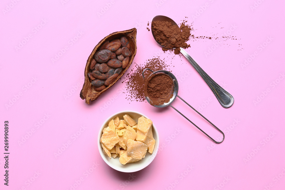 Composition with cocoa powder, beans and butter on color background